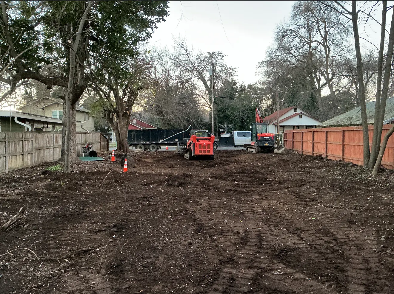 Cleared demolition lot with Demo Patrol equipment on site